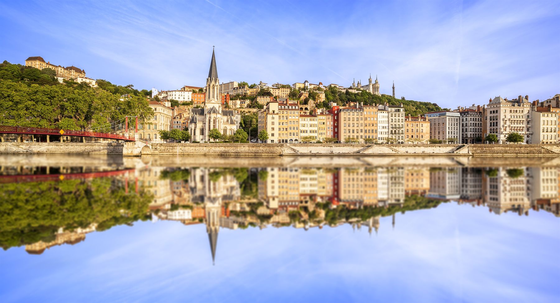Old Lyon and its church spires reflected in the Saône